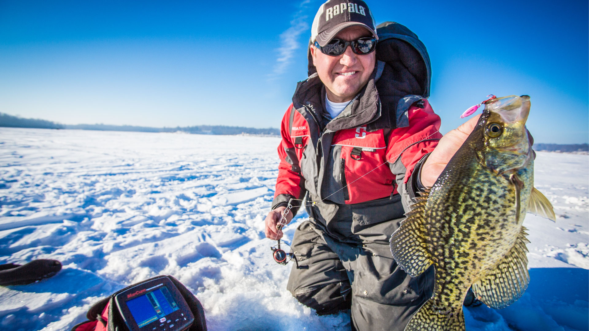 Tony Roach holding crappie with LX-7