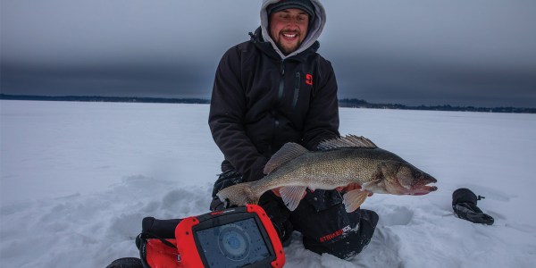 Grant Sorensen holding walleye by RT-9