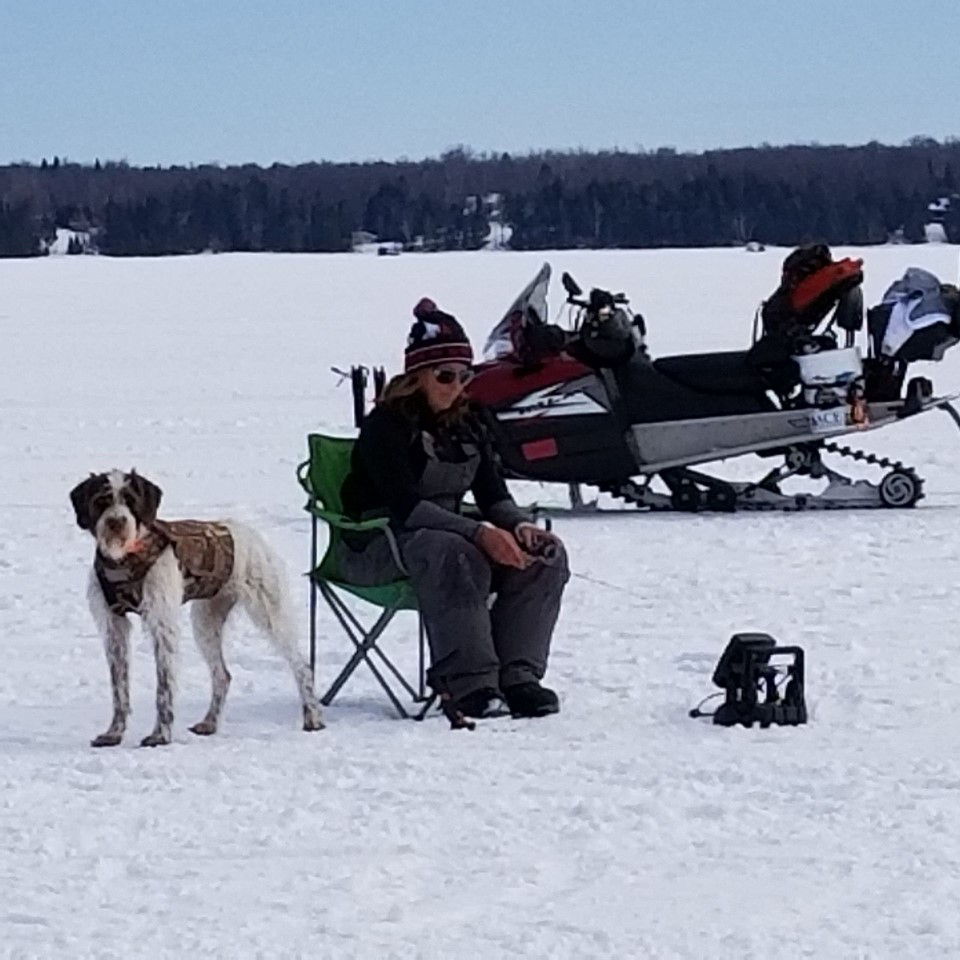 Laura fishing with Pup